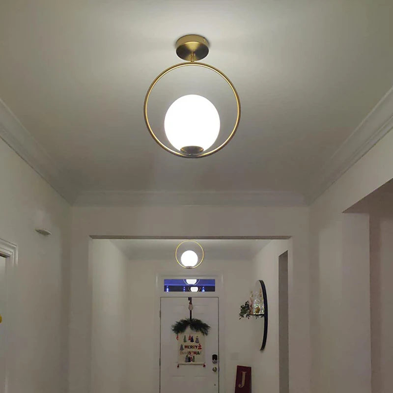 Suspension moderne boule lumineuse tige pliée en laiton 1 ( à split)