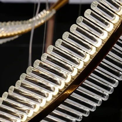 Suspension plume transparente et dorée design moderne