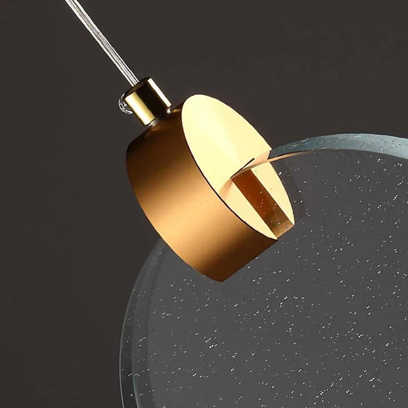 Suspension ronde cristal transparent métal doré