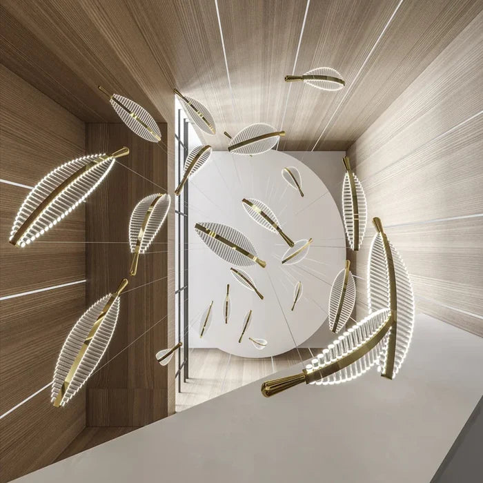 Suspension plume transparente et dorée design moderne