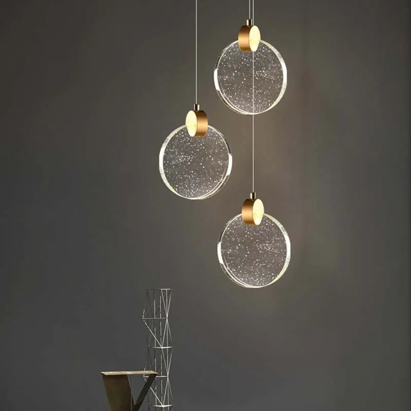Suspension ronde cristal transparent métal doré